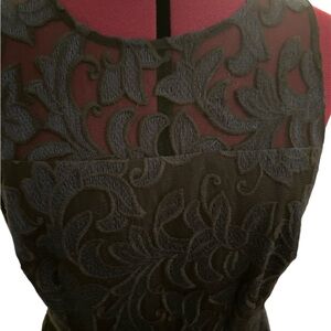 Navy sleeveless dress by Donna Morgan size 8. Top is partially sheer.